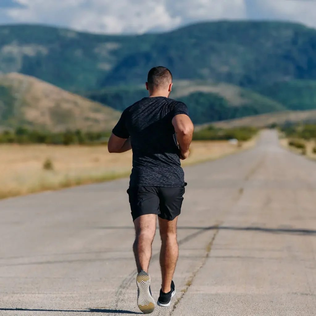 athletic man jogging in the sun preparing his bod 2024 06 12 02 21 41 utc