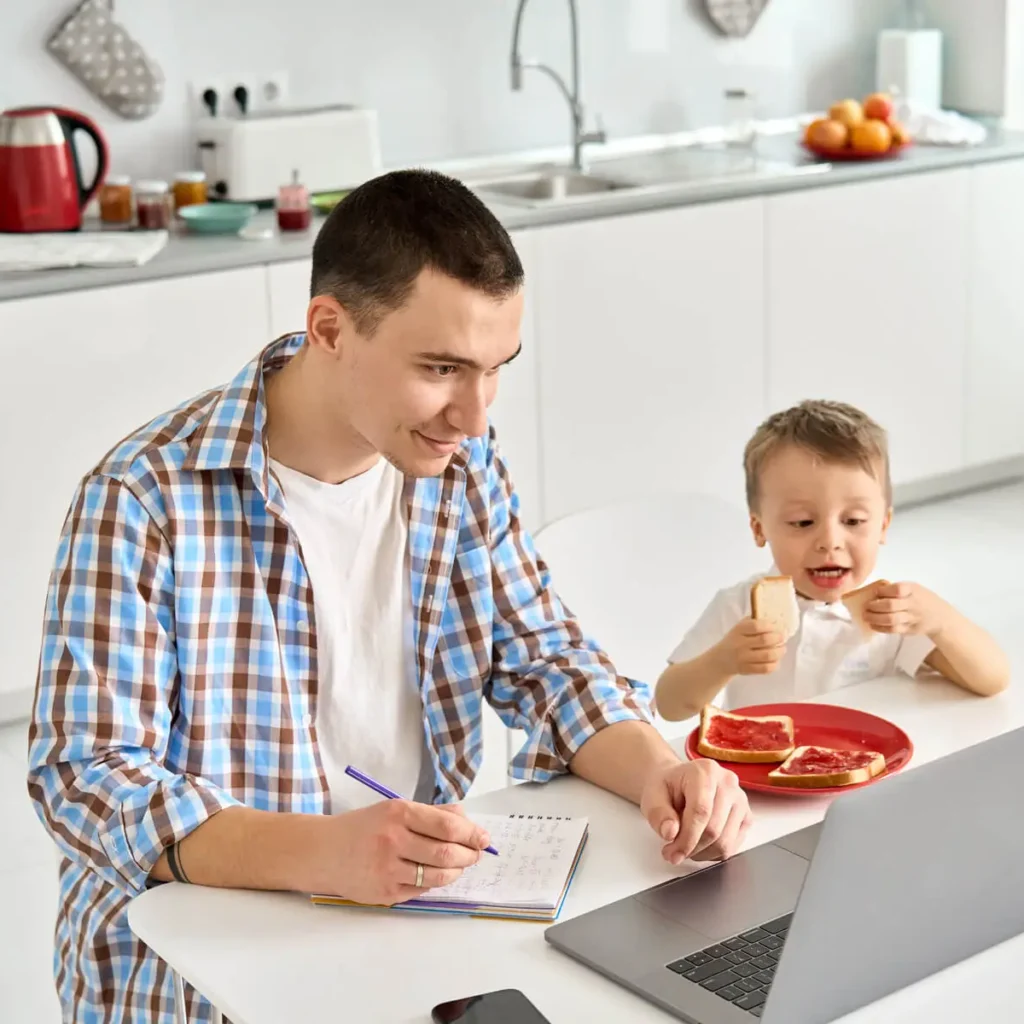 father working from home office using laptop sitti 2023 11 27 05 00 35 utc