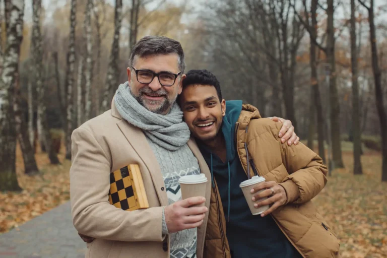 senior and a young man walking and talking and dri 2023 11 27 05 35 35 utc